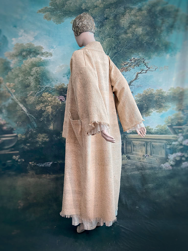 Full length kimono inspired robe with large patch pockets. Newly created from a bolt end of vintage raw silk with the colour and texture of antique hemp grain sacks. All French seamed with hand finished hems and collar. Bohemian styles sustainably created from antique and vintage textiles by the Pavilion Parade studio.