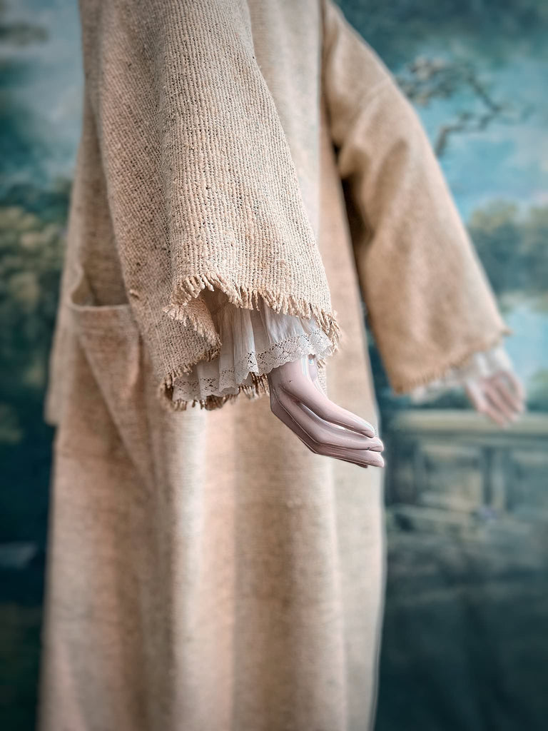 Full length kimono inspired robe with large patch pockets. Newly created from a bolt end of vintage raw silk with the colour and texture of antique hemp grain sacks. All French seamed with hand finished hems and collar. Bohemian styles sustainably created from antique and vintage textiles by the Pavilion Parade studio.