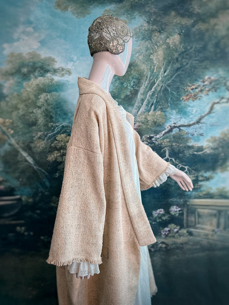 Full length kimono inspired robe with large patch pockets. Newly created from a bolt end of vintage raw silk with the colour and texture of antique hemp grain sacks. All French seamed with hand finished hems and collar. Bohemian styles sustainably created from antique and vintage textiles by the Pavilion Parade studio.