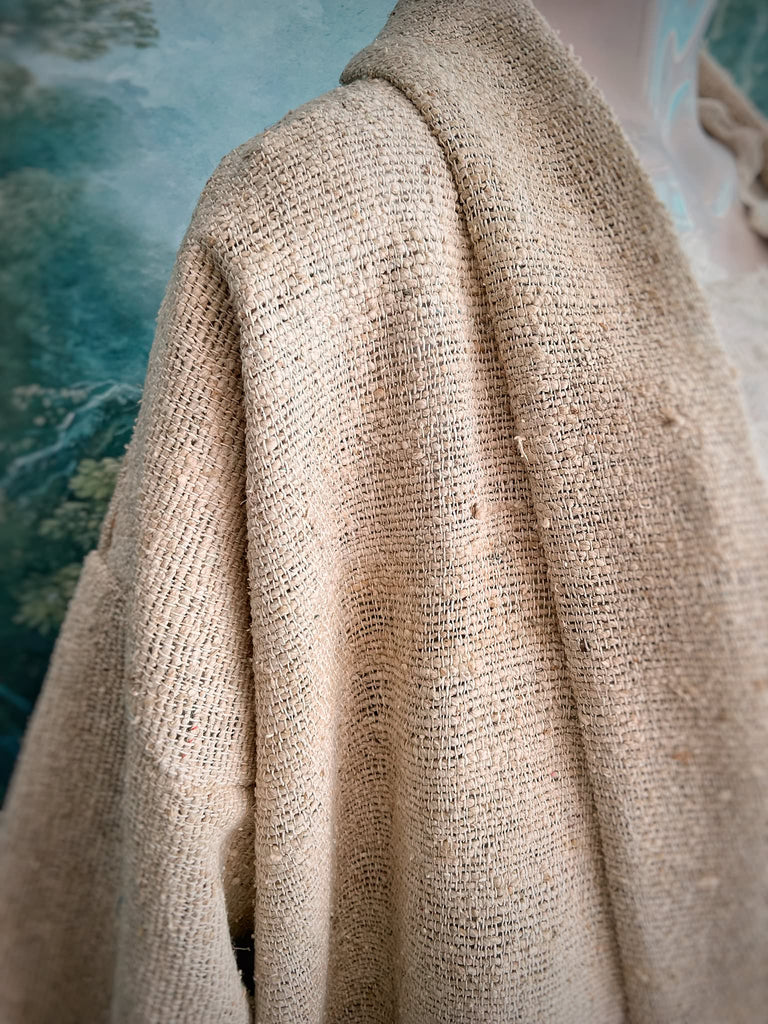 Full length kimono inspired robe with large patch pockets. Newly created from a bolt end of vintage raw silk with the colour and texture of antique hemp grain sacks. All French seamed with hand finished hems and collar. Bohemian styles sustainably created from antique and vintage textiles by the Pavilion Parade studio.