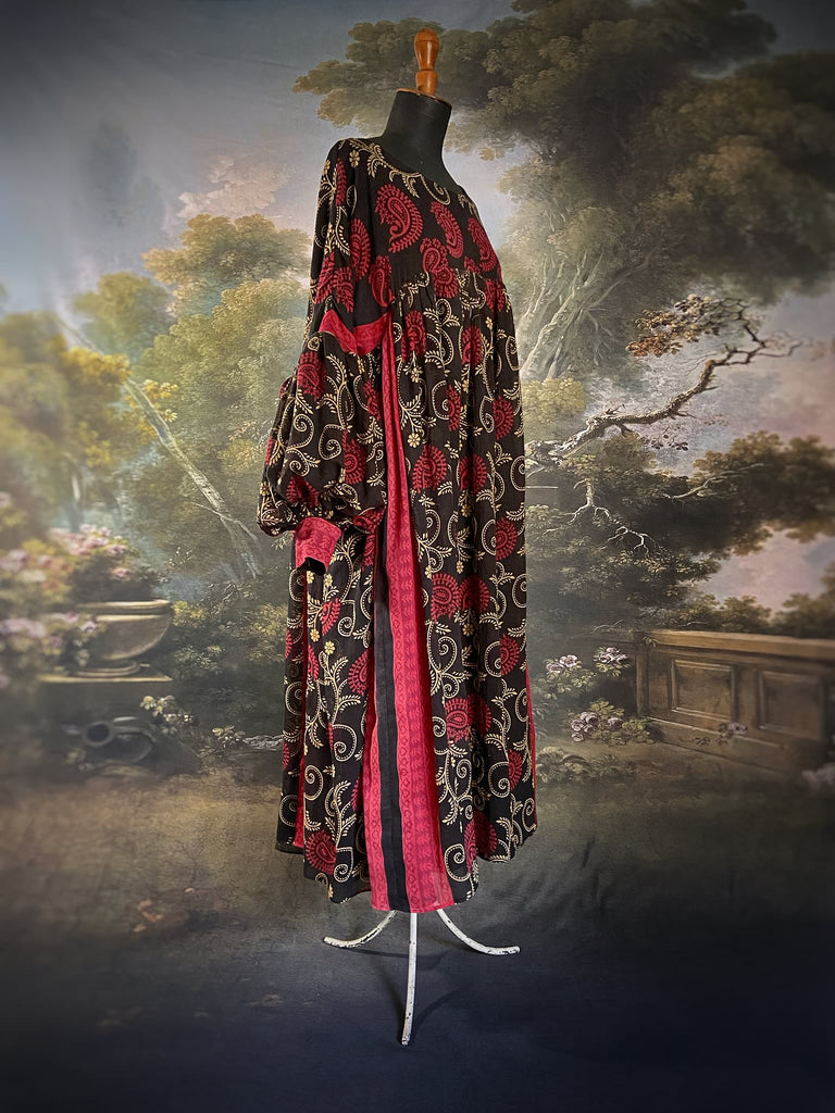 Blood red and ebony black fine cotton volume muslin dress with pockets and full balloon sleeves. Inspired by the aesthetic dress of the early 20th century. Bohemian style sustainably created from vintage and antique textiles by the Pavilion Parade studio