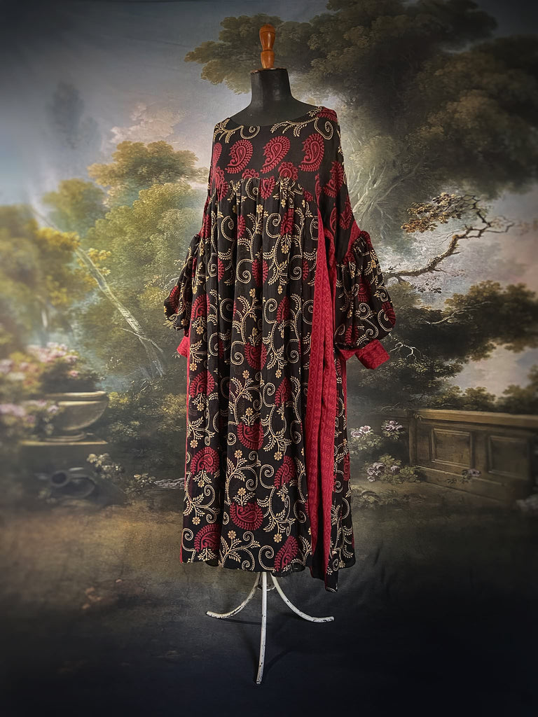 Blood red and ebony black fine cotton volume muslin dress with pockets and full balloon sleeves. Inspired by the aesthetic dress of the early 20th century. Bohemian style sustainably created from vintage and antique textiles by the Pavilion Parade studio