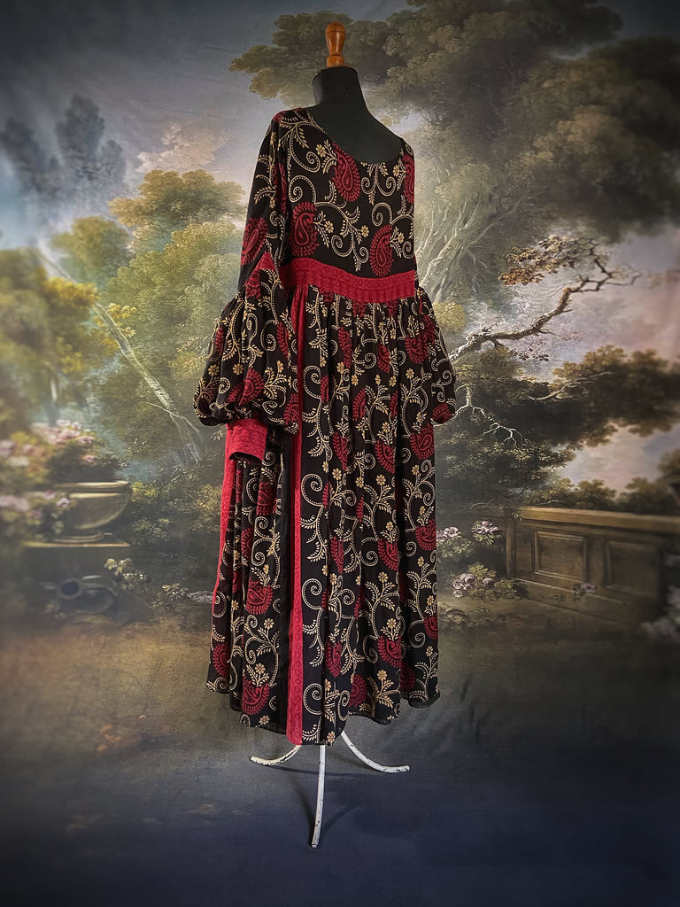 Blood red and ebony black fine cotton volume muslin dress with pockets and full balloon sleeves. Inspired by the aesthetic dress of the early 20th century. Bohemian style sustainably created from vintage and antique textiles by the Pavilion Parade studio