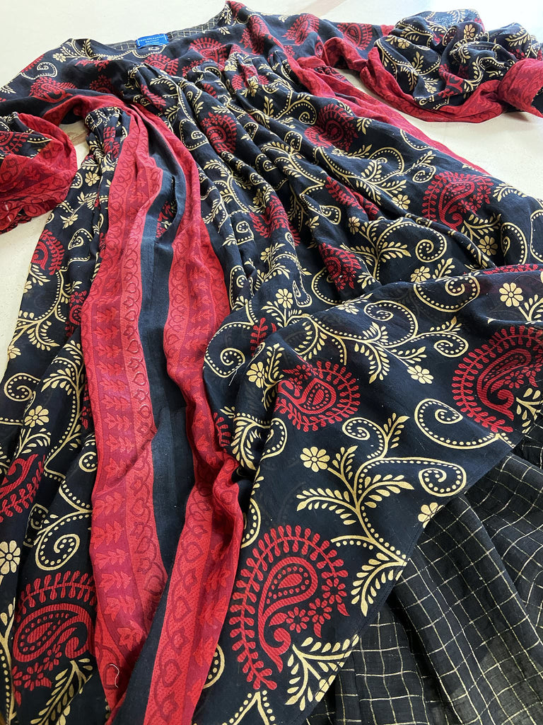 Blood red and ebony black fine cotton volume muslin dress with pockets and full balloon sleeves. Inspired by the aesthetic dress of the early 20th century. Bohemian style sustainably created from vintage and antique textiles by the Pavilion Parade studio