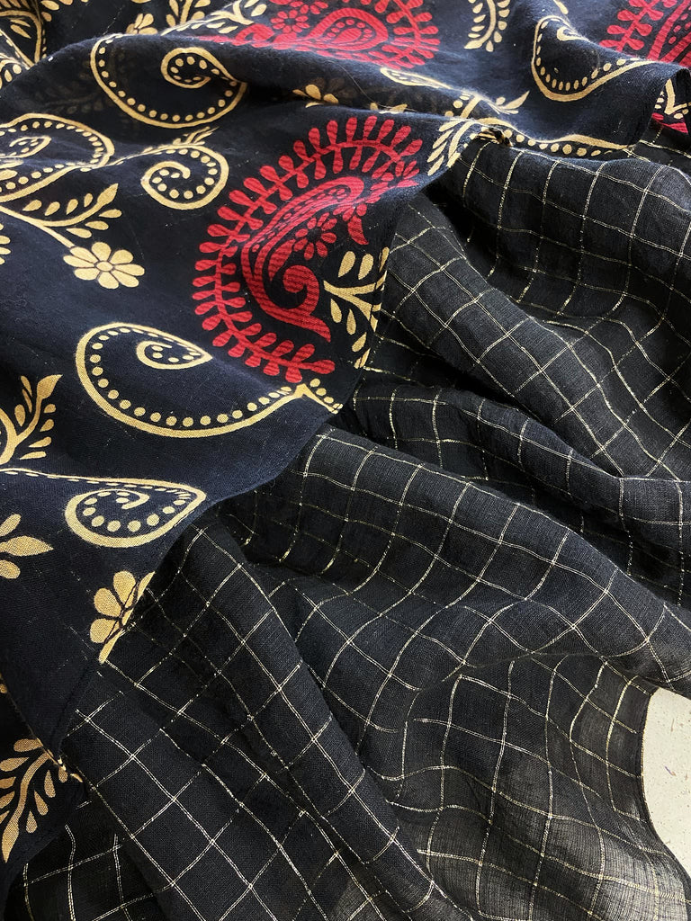 Blood red and ebony black fine cotton volume muslin dress with pockets and full balloon sleeves. Inspired by the aesthetic dress of the early 20th century. Bohemian style sustainably created from vintage and antique textiles by the Pavilion Parade studio