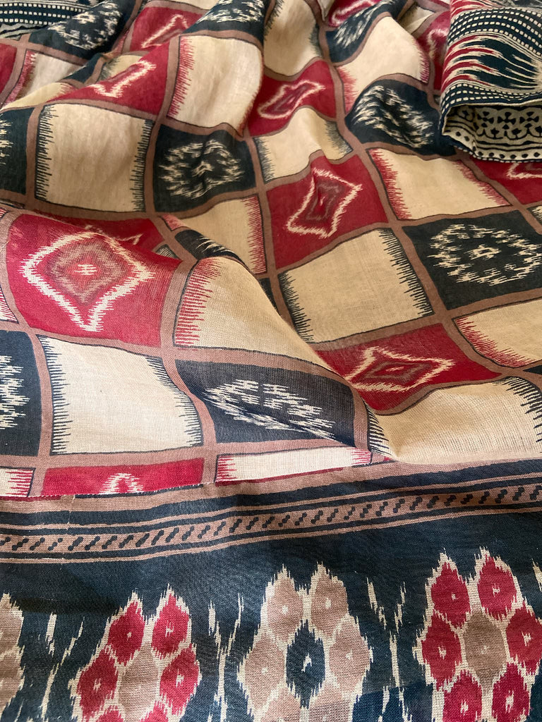 Red and black harlequin ikat print fine cotton voile kaftan dress. Fully lined, with deep pockets, wide sleeves and V neck. Bohemian styles sustainably created from antique and vintage textiles by the Pavilion Parade studio