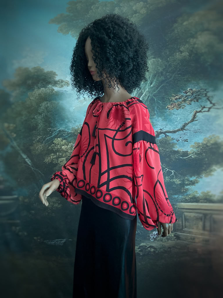Scarlet red and ebony black silk georgette blouse with long full sleeves and adjustable drawstring neckline. Bohemian styles sustainably created from antique and vintage textiles by the Pavilion Parade studio. 