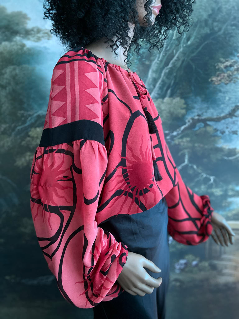 Scarlet red and ebony black silk georgette blouse with long full sleeves and adjustable drawstring neckline. Bohemian styles sustainably created from antique and vintage textiles by the Pavilion Parade studio. 
