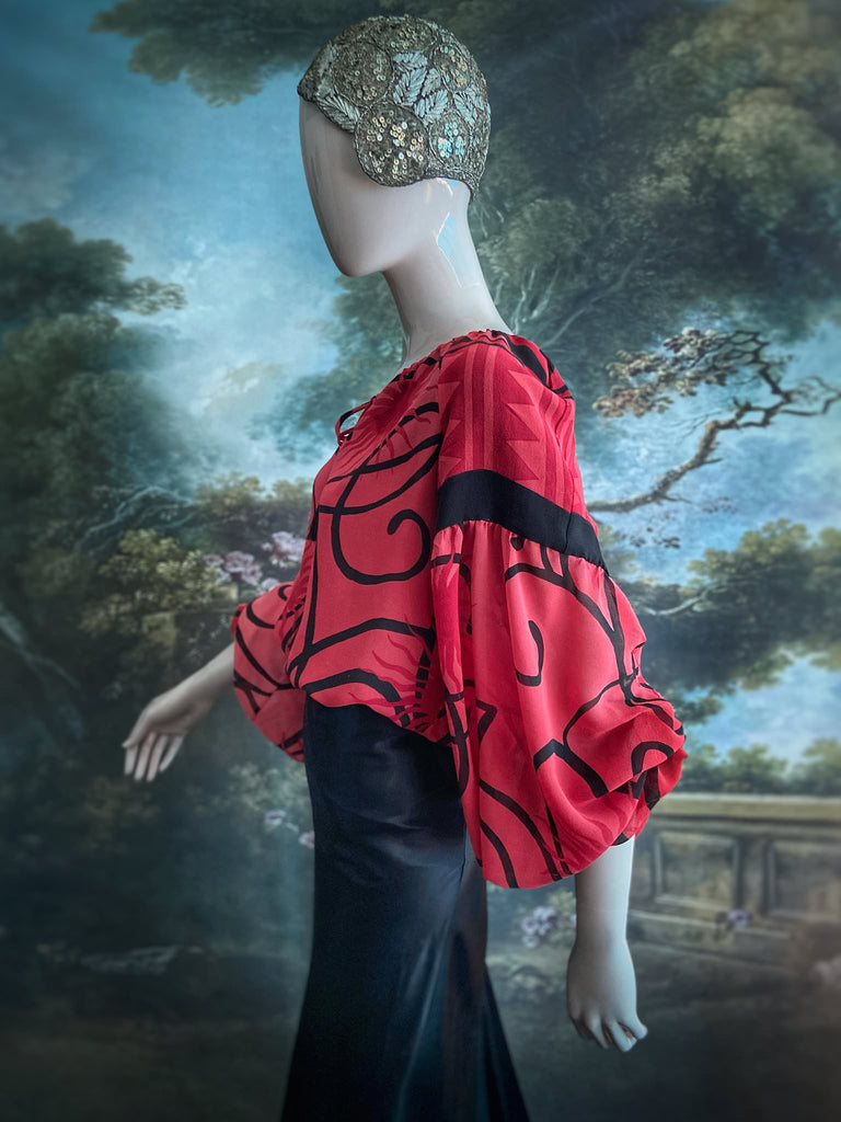 Scarlet red and ebony black silk georgette blouse with long full sleeves and adjustable drawstring neckline. Bohemian styles sustainably created from antique and vintage textiles by the Pavilion Parade studio. 