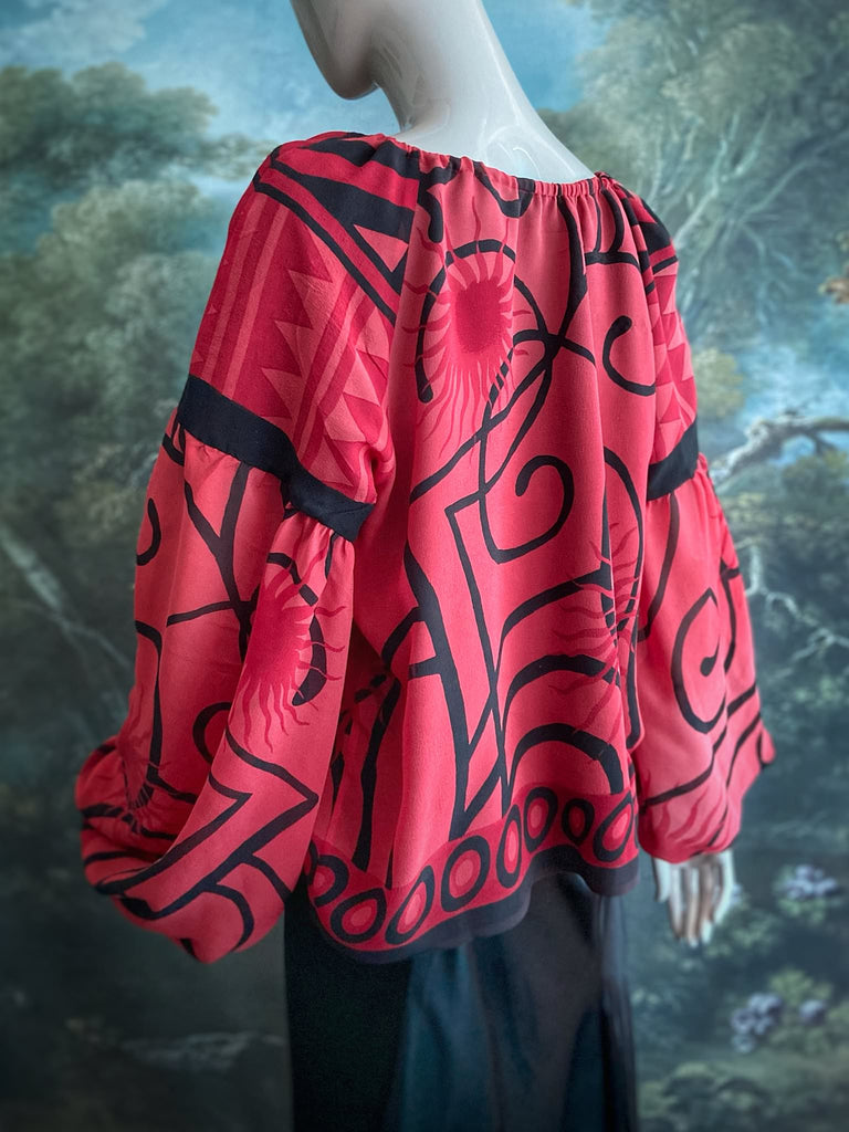 Scarlet red and ebony black silk georgette blouse with long full sleeves and adjustable drawstring neckline. Bohemian styles sustainably created from antique and vintage textiles by the Pavilion Parade studio. 