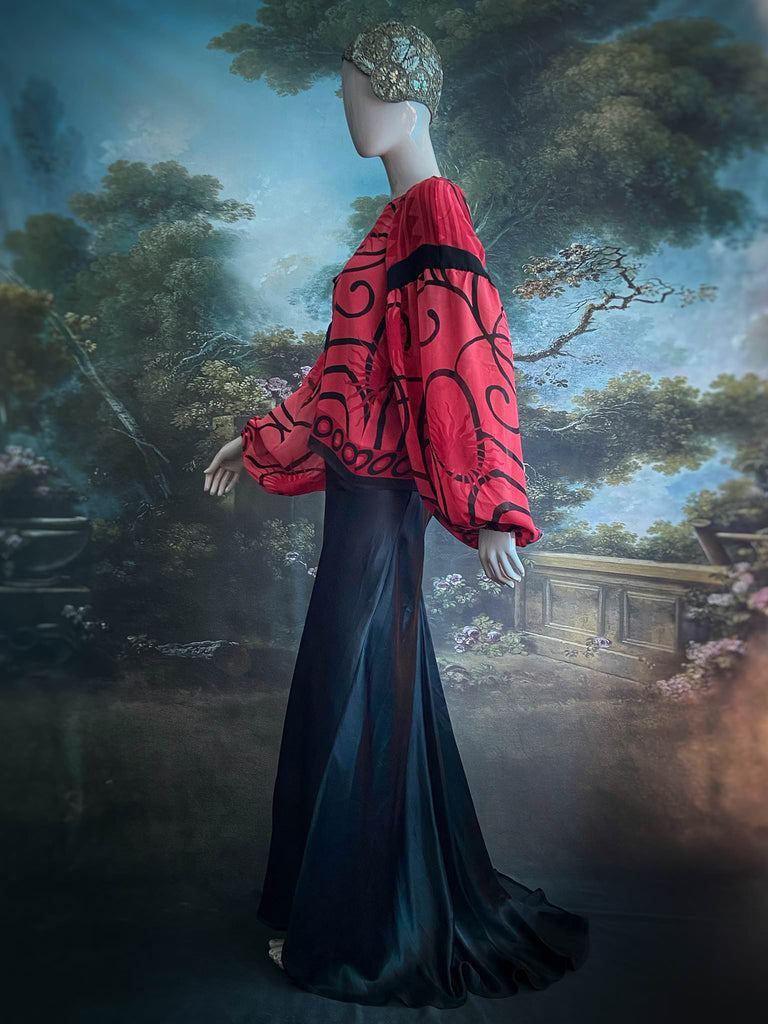 Scarlet red and ebony black silk georgette blouse with long full sleeves and adjustable drawstring neckline. Bohemian styles sustainably created from antique and vintage textiles by the Pavilion Parade studio. 