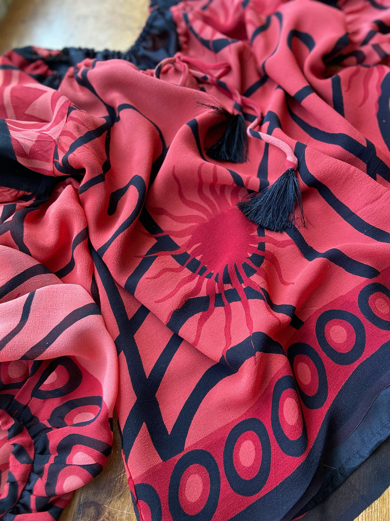 Scarlet red and ebony black silk georgette blouse with long full sleeves and adjustable drawstring neckline. Bohemian styles sustainably created from antique and vintage textiles by the Pavilion Parade studio. 