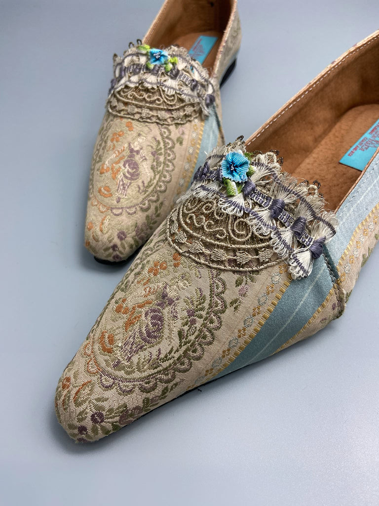 Pale blue and ecru silk brocade Regency inspired dancing slippers with rare 18th century silk fly  fringe embellishment . Bohemian style sustainably created from antique textiles by the Pavilion Parade studio.