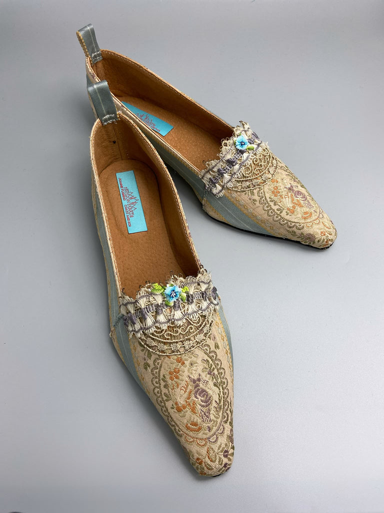 Pale blue and ecru silk brocade Regency inspired dancing slippers with rare 18th century silk fly  fringe embellishment . Bohemian style sustainably created from antique textiles by the Pavilion Parade studio.