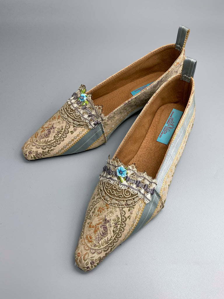 Pale blue and ecru silk brocade Regency inspired dancing slippers with rare 18th century silk fly  fringe embellishment . Bohemian style sustainably created from antique textiles by the Pavilion Parade studio.
