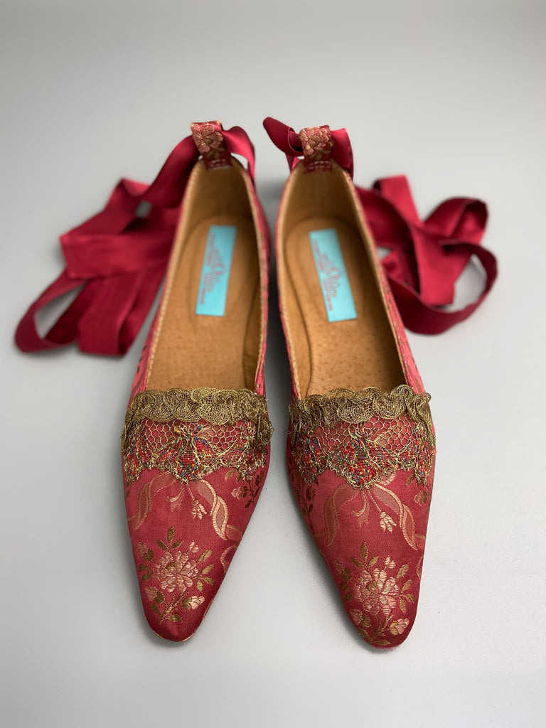 Deep rose pink silk brocade Regency inspired dancing slippers with metallic gold filigree lace embellishment and silk satin ankle ribbons. Bohemian style sustainably created from antique textiles by the Pavilion Parade studio.