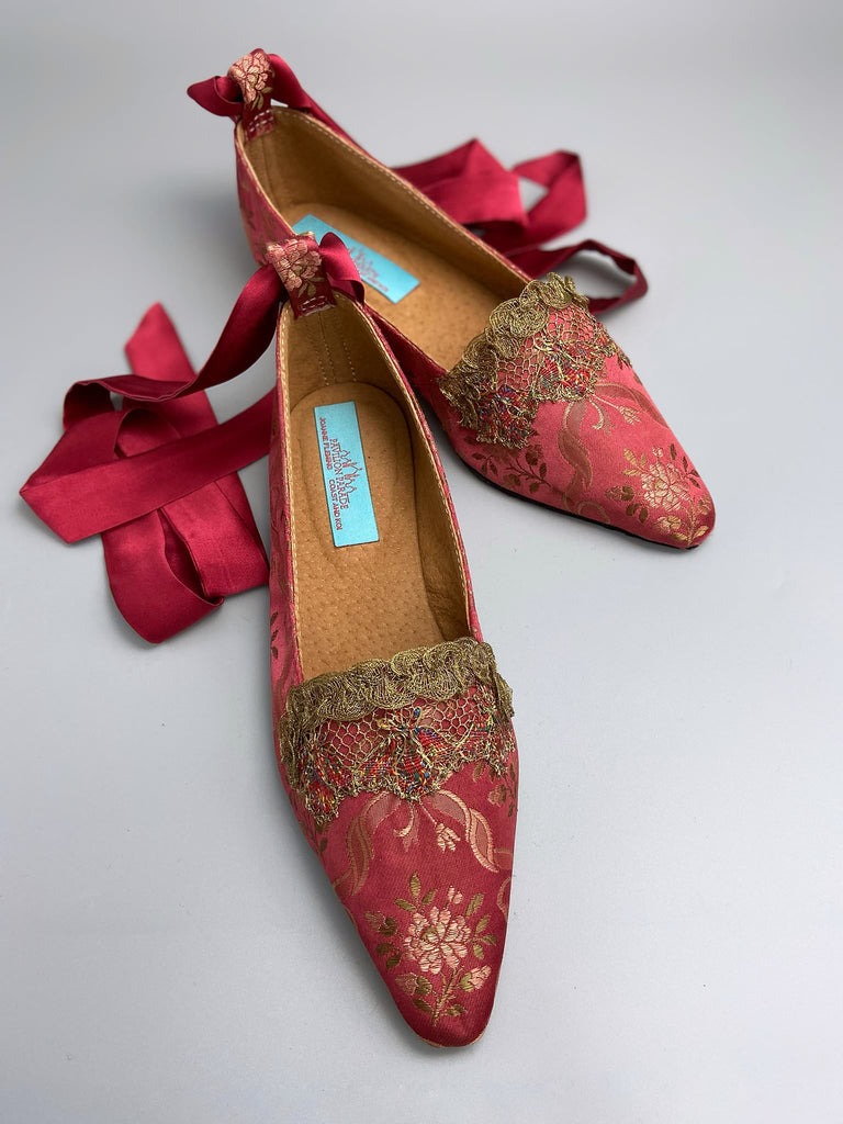 Deep rose pink silk brocade Regency inspired dancing slippers with metallic gold filigree lace embellishment and silk satin ankle ribbons. Bohemian style sustainably created from antique textiles by the Pavilion Parade studio.