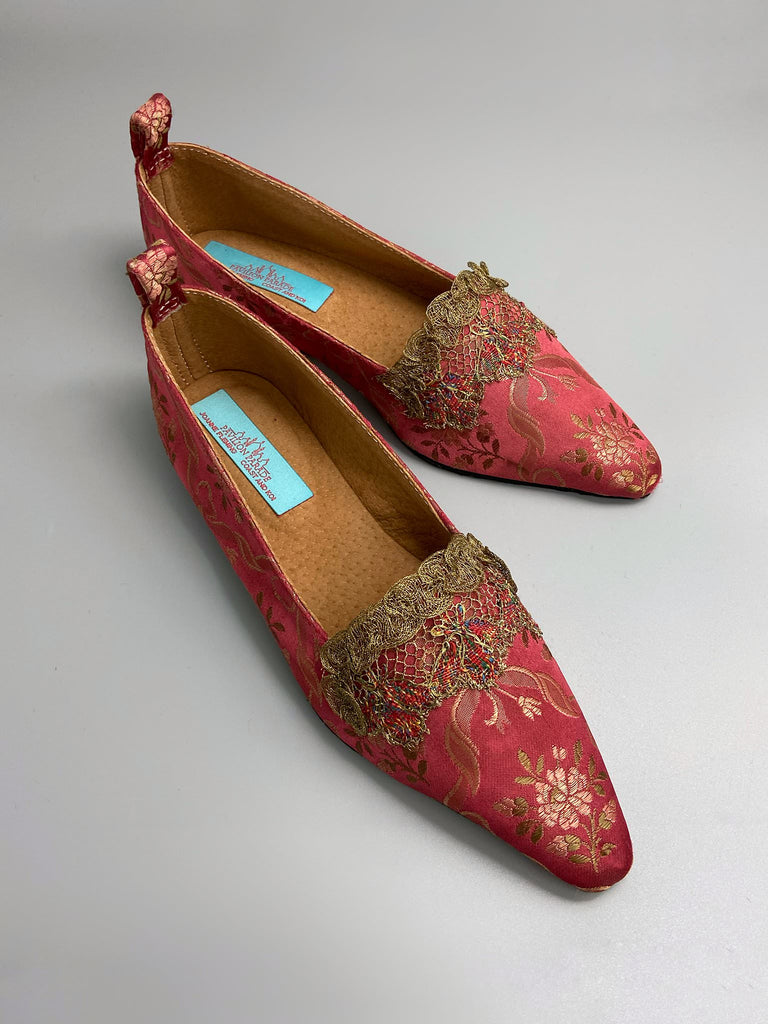 Deep rose pink silk brocade Regency inspired dancing slippers with metallic gold filigree lace embellishment and silk satin ankle ribbons. Bohemian style sustainably created from antique textiles by the Pavilion Parade studio.