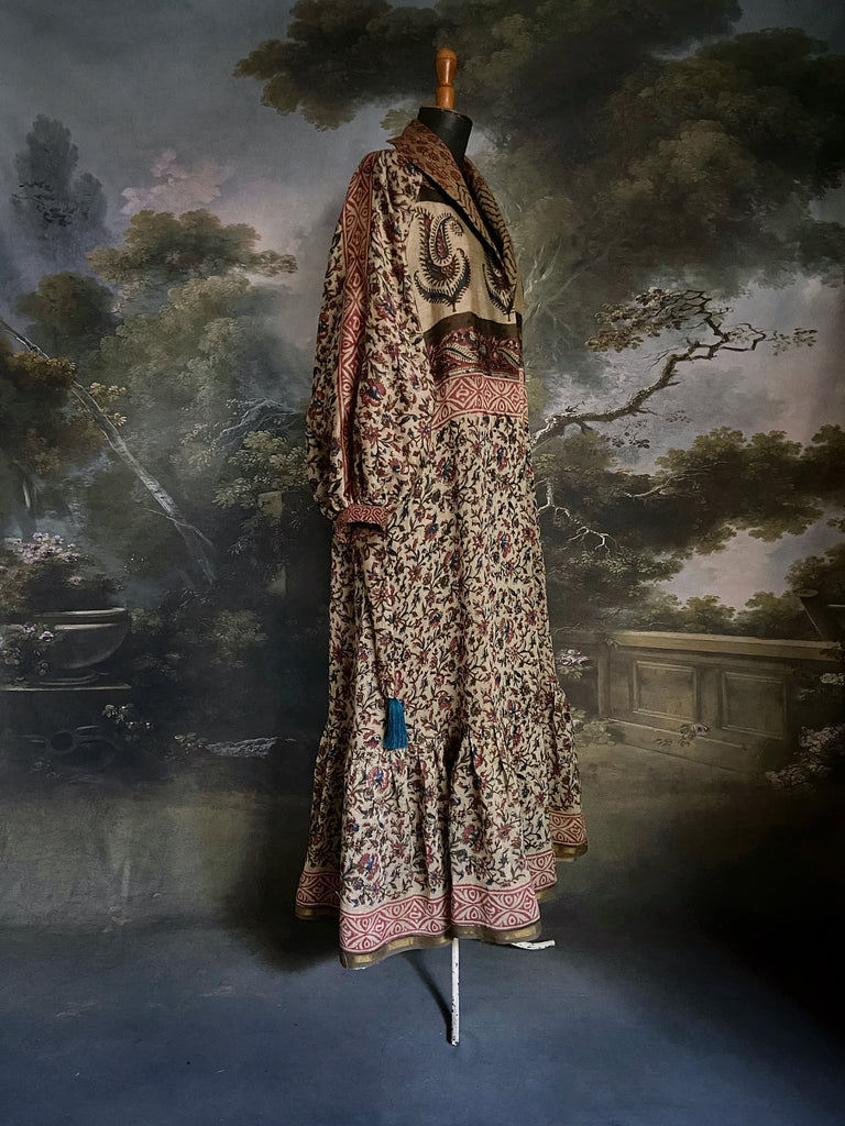 Reversible hand block printed pure cotton robe with full  bishop sleeves , side pockets and a tassel sash belt. Sustainably created from antique and vintage textiless by the Pavilion Parade studio.