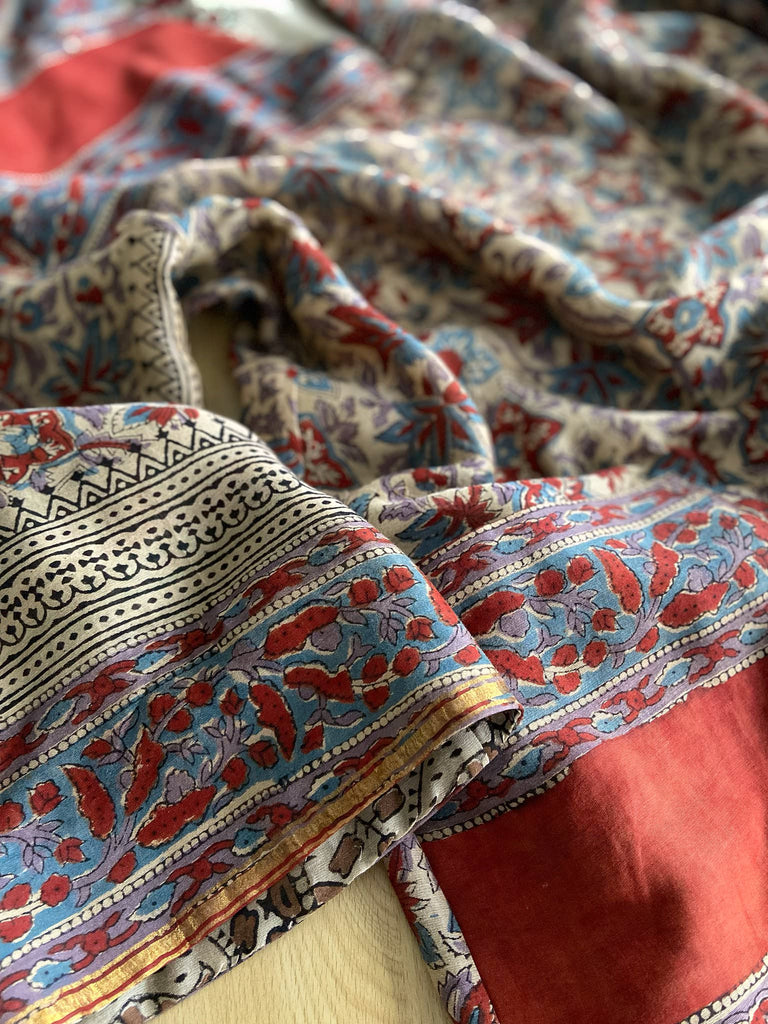Reversible block printed kalamkari cotton kaftan dress. Slate blue and rust Indienne paisley and floral motif. Deep pockets, wide sleeves and a relaxed fit. Bohemian style created from vintage and antique textiles by the Pavilion Parade studio.