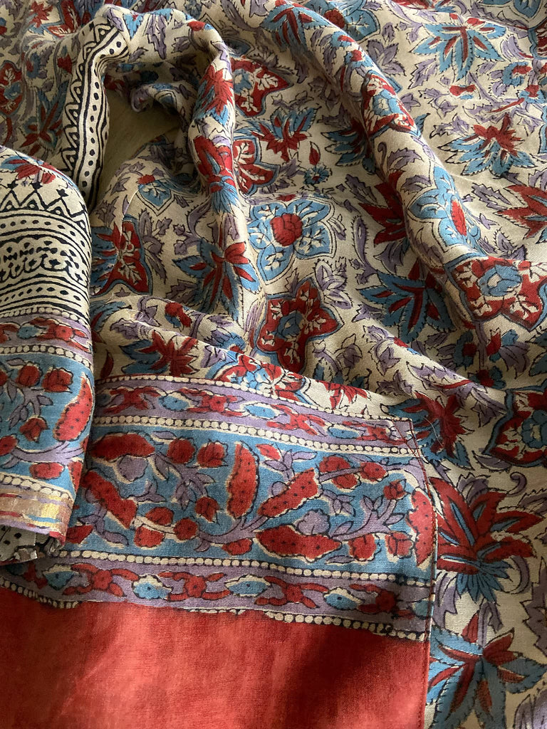 Reversible block printed kalamkari cotton kaftan dress. Slate blue and rust Indienne paisley and floral motif. Deep pockets, wide sleeves and a relaxed fit. Bohemian style created from vintage and antique textiles by the Pavilion Parade studio.