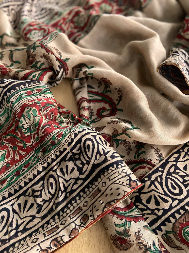 Reversible block printed kalamkari cotton kaftan dress. Slate blue and rust Indienne paisley and floral motif. Deep pockets, wide sleeves and a relaxed fit. Bohemian style created from vintage and antique textiles by the Pavilion Parade studio.