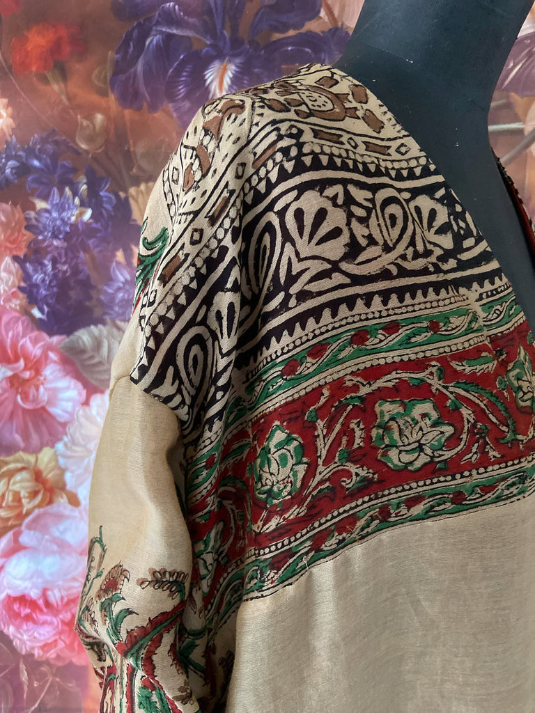 Reversible block printed kalamkari cotton kaftan dress. Slate blue and rust Indienne paisley and floral motif. Deep pockets, wide sleeves and a relaxed fit. Bohemian style created from vintage and antique textiles by the Pavilion Parade studio.