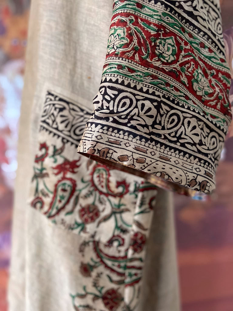 Reversible block printed kalamkari cotton kaftan dress. Slate blue and rust Indienne paisley and floral motif. Deep pockets, wide sleeves and a relaxed fit. Bohemian style created from vintage and antique textiles by the Pavilion Parade studio.