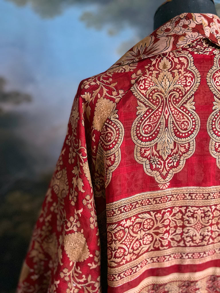 Reversible red and golden yellow cotton kalamkari and voile robe with balloon sleeves, side pockets, and tassel sash. Unique bohemian style sustainably created from vintage textiles by the Pavilion Parade Studio