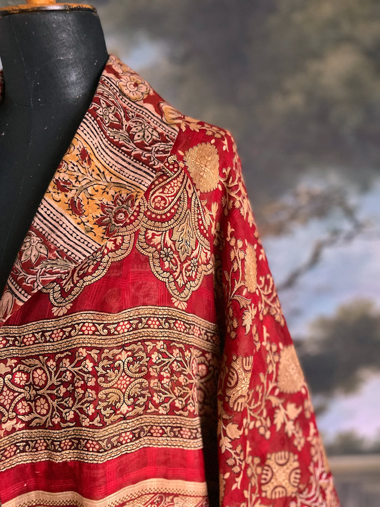 Reversible red and golden yellow cotton kalamkari and voile robe with balloon sleeves, side pockets, and tassel sash. Unique bohemian style sustainably created from vintage textiles by the Pavilion Parade Studio