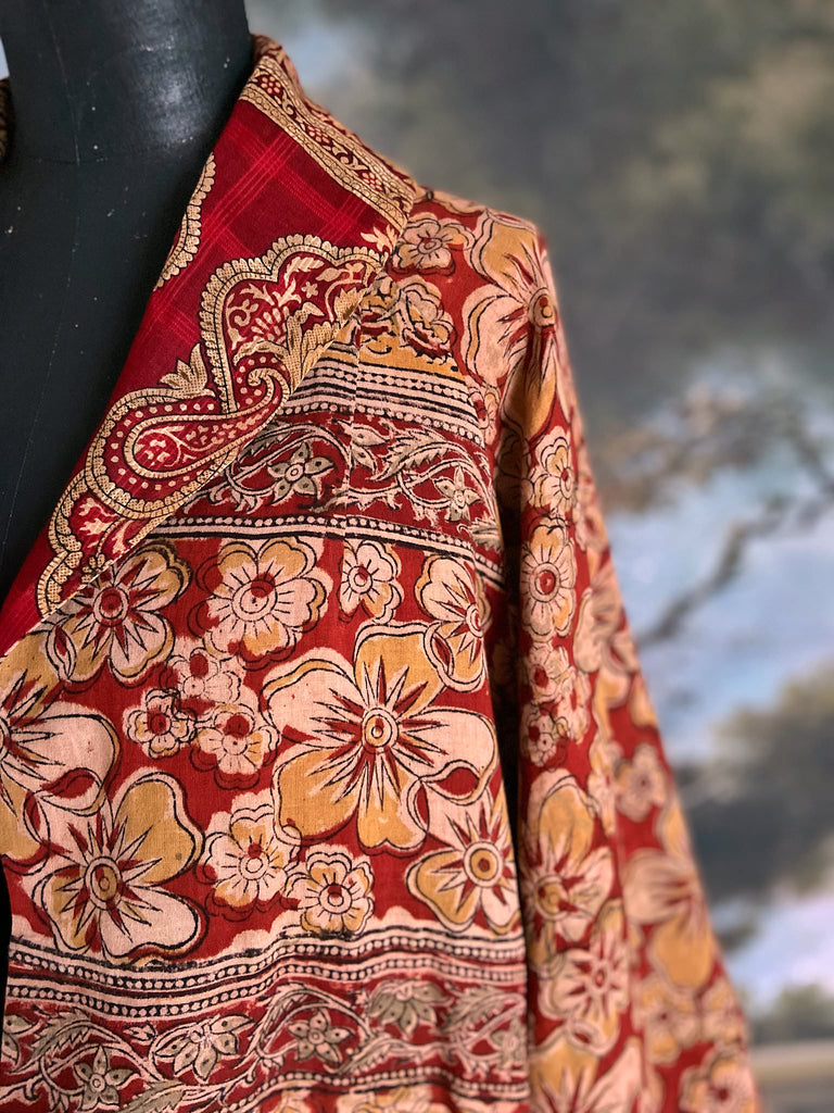 Reversible red and golden yellow cotton kalamkari and voile robe with balloon sleeves, side pockets, and tassel sash. Unique bohemian style sustainably created from vintage textiles by the Pavilion Parade Studio
