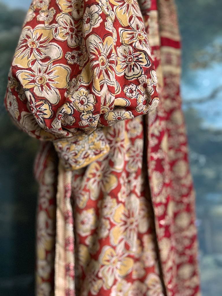 Reversible red and golden yellow cotton kalamkari and voile robe with balloon sleeves, side pockets, and tassel sash. Unique bohemian style sustainably created from vintage textiles by the Pavilion Parade Studio