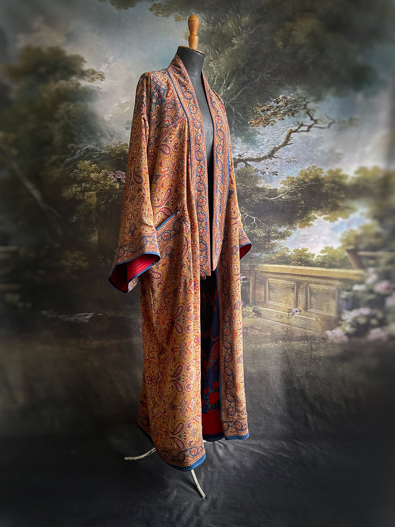 Saffron, red, and cerulean blue paisley silk crepe 1920s inspired kimono robe. Bohemian styles sustainably created from vintage textiles by the Pavilion Parade studio.