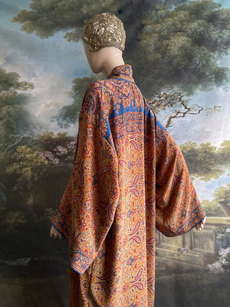Saffron, red, and cerulean blue paisley silk crepe 1920s inspired kimono robe. Bohemian styles sustainably created from vintage textiles by the Pavilion Parade studio.