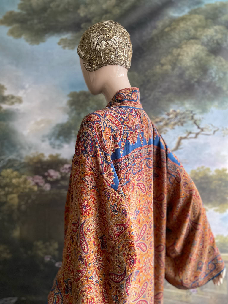 Saffron, red, and cerulean blue paisley silk crepe 1920s inspired kimono robe. Bohemian styles sustainably created from vintage textiles by the Pavilion Parade studio.