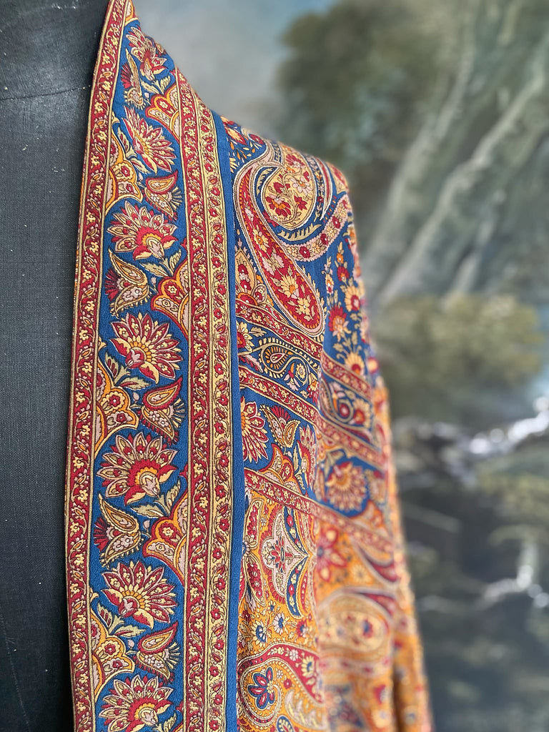 Saffron, red, and cerulean blue paisley silk crepe 1920s inspired kimono robe. Bohemian styles sustainably created from vintage textiles by the Pavilion Parade studio.