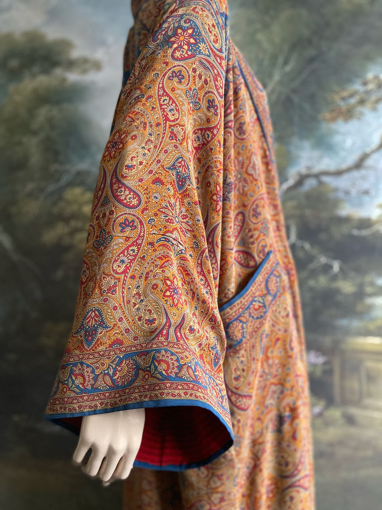 Saffron, red, and cerulean blue paisley silk crepe 1920s inspired kimono robe. Bohemian styles sustainably created from vintage textiles by the Pavilion Parade studio.