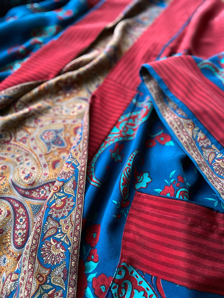 Saffron, red, and cerulean blue reversible paisley silk crepe 1920s inspired kimono robe. Bohemian styles sustainably created from vintage textiles by the Pavilion Parade studio.