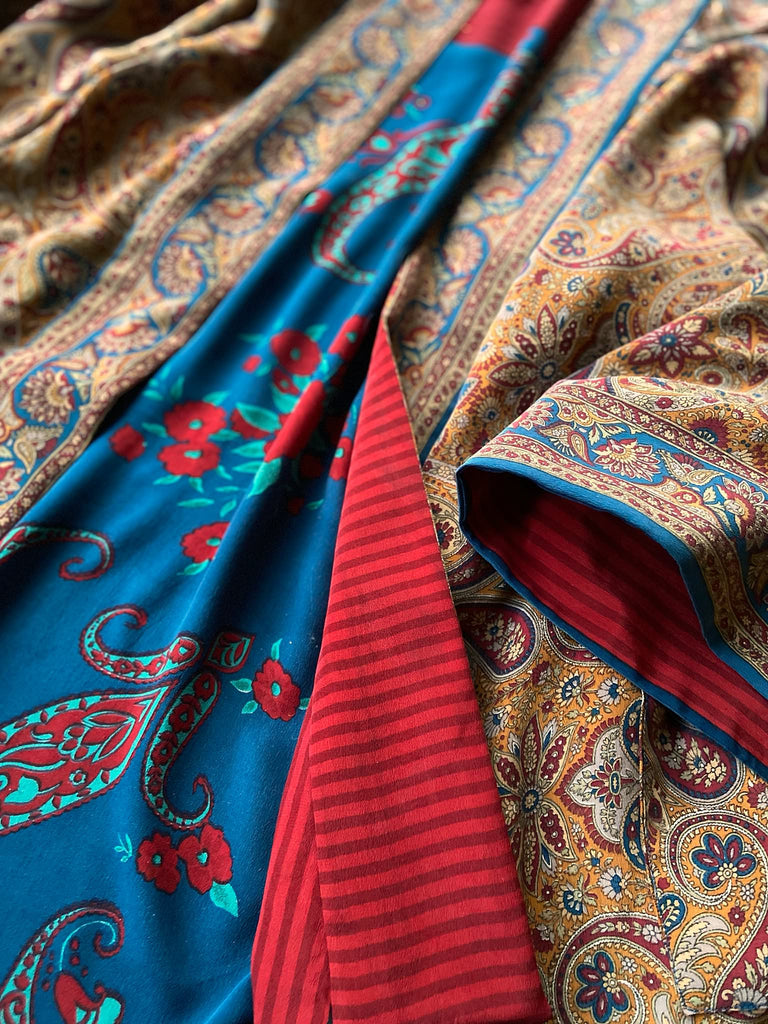 Saffron, red, and cerulean blue reversible paisley silk crepe 1920s inspired kimono robe. Bohemian styles sustainably created from vintage textiles by the Pavilion Parade studio.