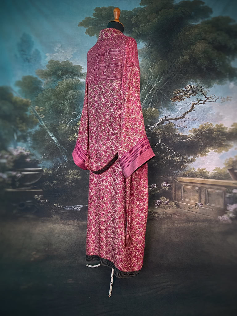 Rose pink silk lined fine wool dressing robe with wide sleeves, deep pockets and tassel sash. Bohemian styles sustainably created from antique and vintage textiles by the Pavilion Parade studio