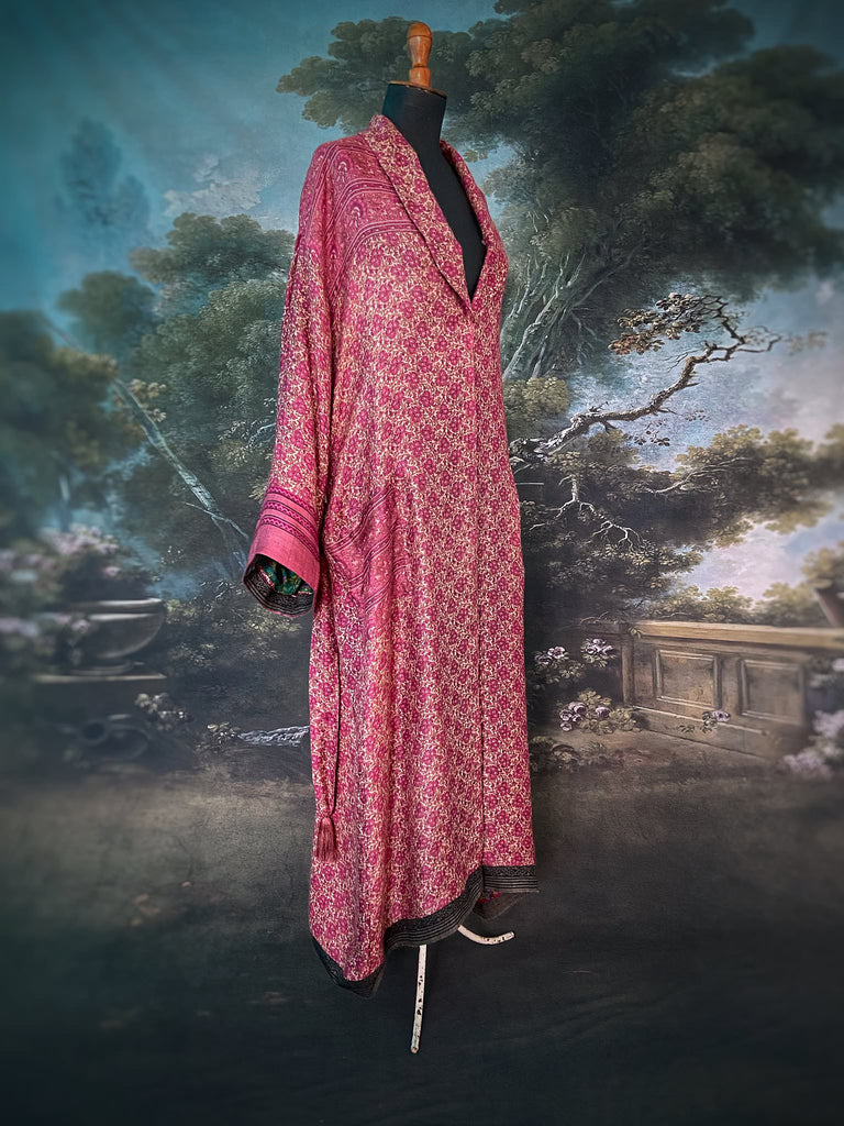 Rose pink silk lined fine wool dressing robe with wide sleeves, deep pockets and tassel sash. Bohemian styles sustainably created from antique and vintage textiles by the Pavilion Parade studio