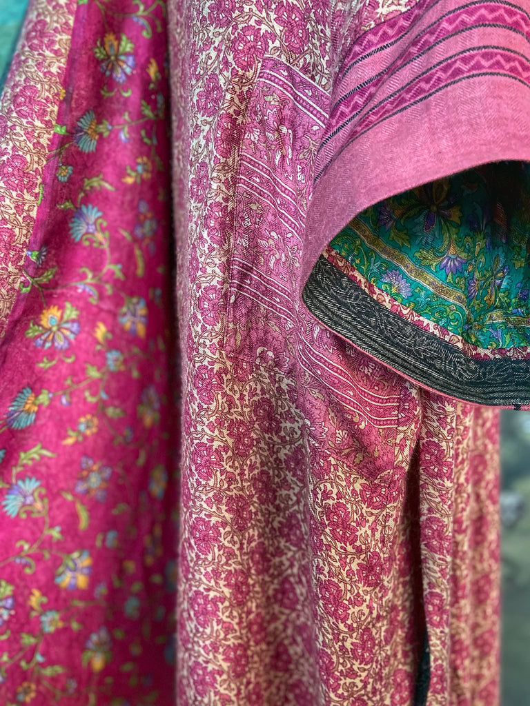 Rose pink silk lined fine wool dressing robe with wide sleeves, deep pockets and tassel sash. Bohemian styles sustainably created from antique and vintage textiles by the Pavilion Parade studio