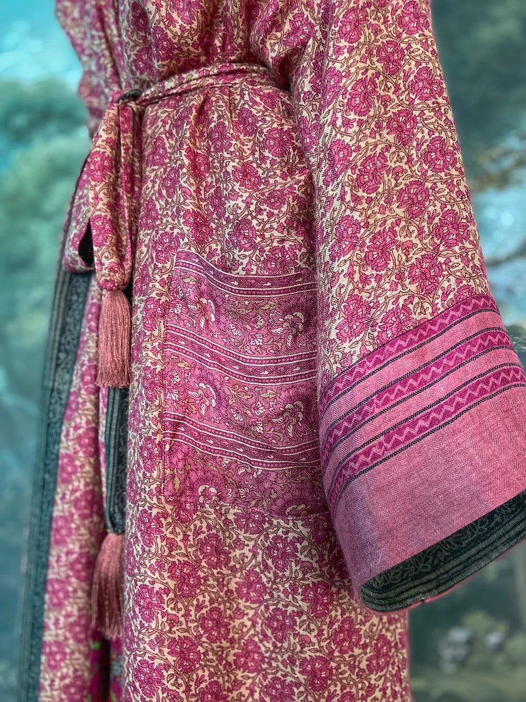 Rose pink silk lined fine wool dressing robe with wide sleeves, deep pockets and tassel sash. Bohemian styles sustainably created from antique and vintage textiles by the Pavilion Parade studio