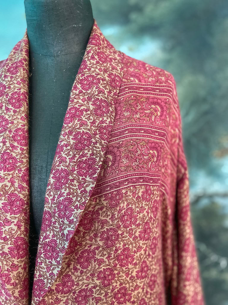 Rose pink silk lined fine wool dressing robe with wide sleeves, deep pockets and tassel sash. Bohemian styles sustainably created from antique and vintage textiles by the Pavilion Parade studio