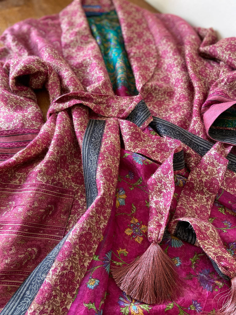 Rose pink silk lined fine wool dressing robe with wide sleeves, deep pockets and tassel sash. Bohemian styles sustainably created from antique and vintage textiles by the Pavilion Parade studio