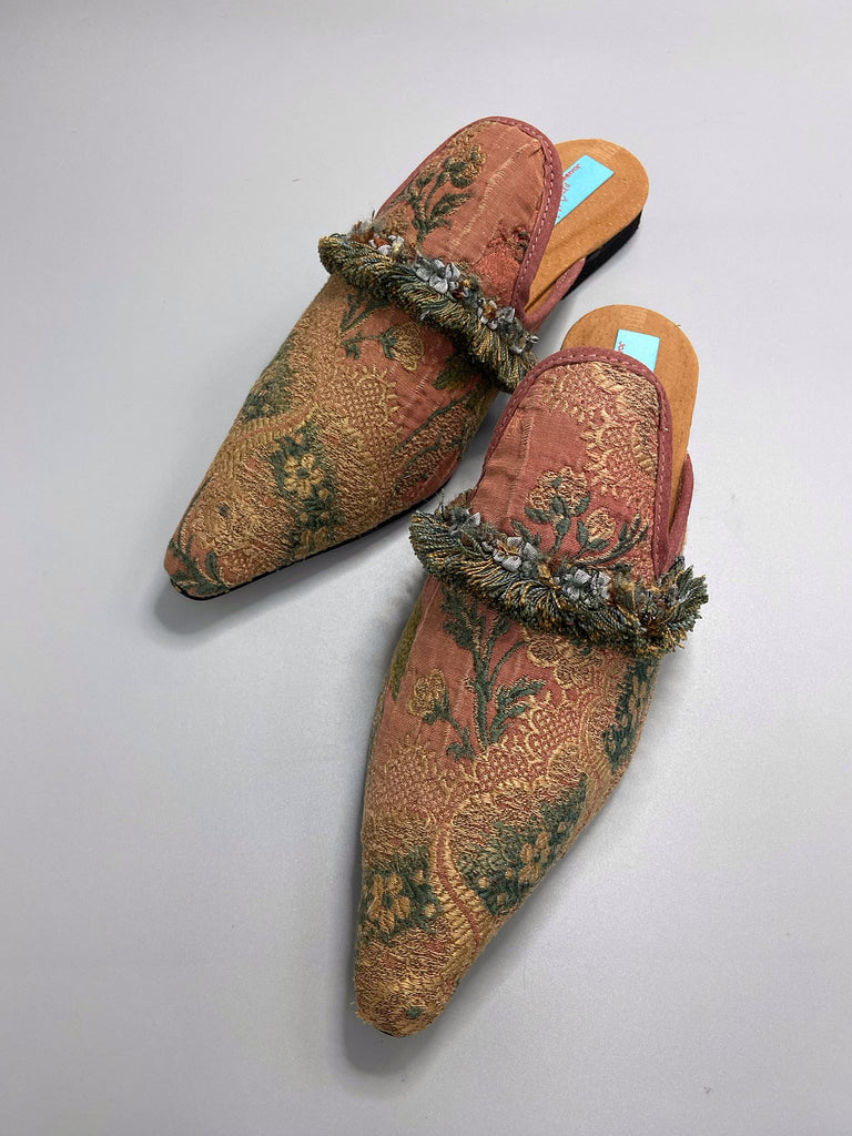 Muted rose pink and slate blue silk brocade pointed toe shoes with tassel fringe and rococo ribbon trims. Created from antique textiles by the Pavilion Parade Studio