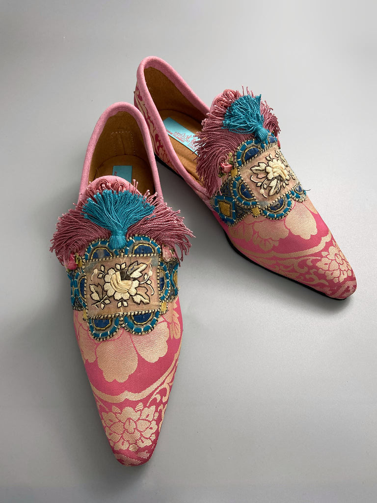 Rose pink and blue tassel silk brocade pointed toe shoes sustainably created using antique textiles and embellishments by the Pavilion Parade studio.