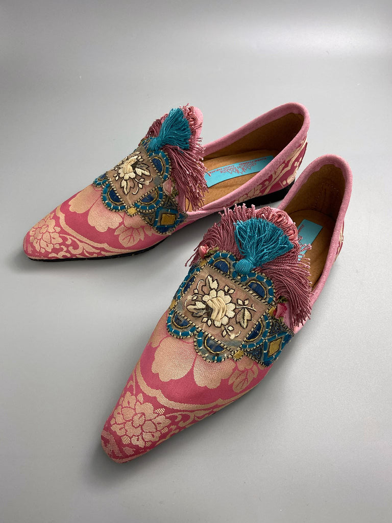 Rose pink and blue tassel silk brocade pointed toe shoes sustainably created using antique textiles and embellishments by the Pavilion Parade studio.