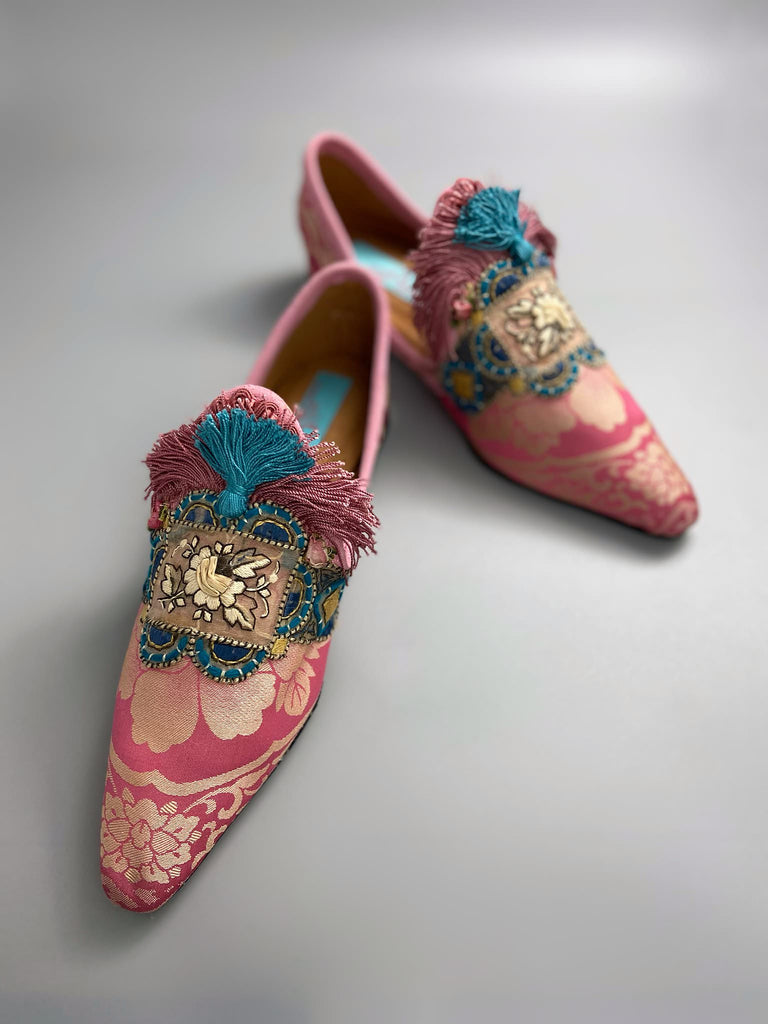 Rose pink and blue tassel silk brocade pointed toe shoes sustainably created using antique textiles and embellishments by the Pavilion Parade studio.