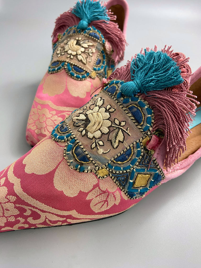 Rose pink and blue tassel silk brocade pointed toe shoes sustainably created using antique textiles and embellishments by the Pavilion Parade studio.